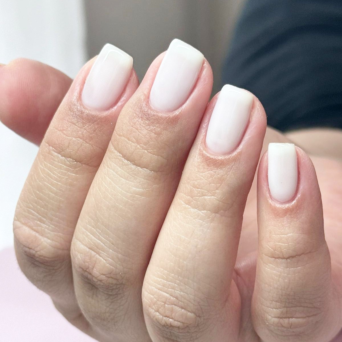 Short square nails with a milky white finish